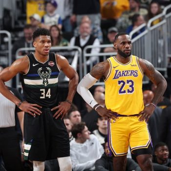 Giannis Antetokounmpo standing next to LeBron James